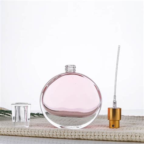 designer perfume with flat round bottle